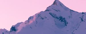 Preview wallpaper mountain, peak, snow, winter, sunset, sky, pink