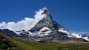 Preview wallpaper mountain, peak, snow, snowy, clouds, grass