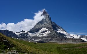 Preview wallpaper mountain, peak, snow, snowy, clouds, grass