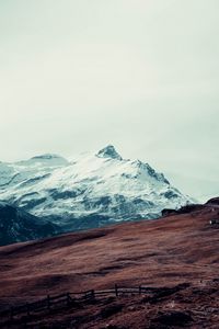 Preview wallpaper mountain, peak, snow, hut, fence