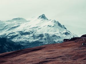 Preview wallpaper mountain, peak, snow, hut, fence