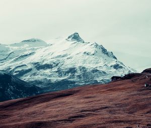 Preview wallpaper mountain, peak, snow, hut, fence