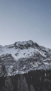 Preview wallpaper mountain, peak, snowy, stars, snowfall, sky