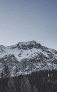 Preview wallpaper mountain, peak, snowy, stars, snowfall, sky