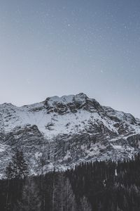 Preview wallpaper mountain, peak, snowy, stars, snowfall, sky