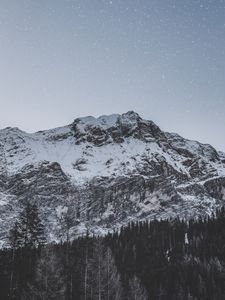 Preview wallpaper mountain, peak, snowy, stars, snowfall, sky