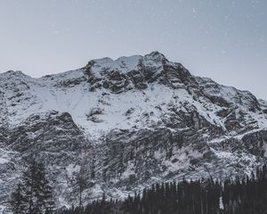 Preview wallpaper mountain, peak, snowy, stars, snowfall, sky