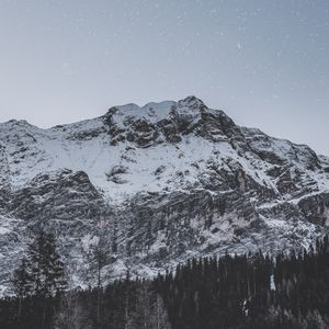 Preview wallpaper mountain, peak, snowy, stars, snowfall, sky