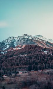 Preview wallpaper mountain, peak, snowy, village, sky