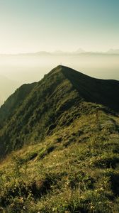 Preview wallpaper mountain, peak, sunlight, fog, grass