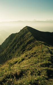 Preview wallpaper mountain, peak, sunlight, fog, grass