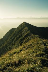 Preview wallpaper mountain, peak, sunlight, fog, grass