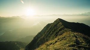 Preview wallpaper mountain, peak, sunlight, fog, grass