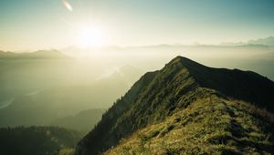Preview wallpaper mountain, peak, sunlight, fog, grass