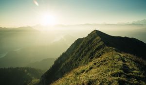 Preview wallpaper mountain, peak, sunlight, fog, grass