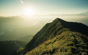 Preview wallpaper mountain, peak, sunlight, fog, grass
