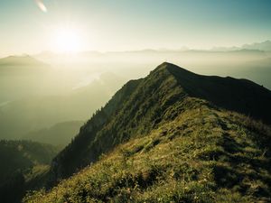 Preview wallpaper mountain, peak, sunlight, fog, grass