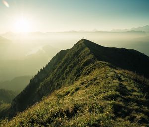 Preview wallpaper mountain, peak, sunlight, fog, grass