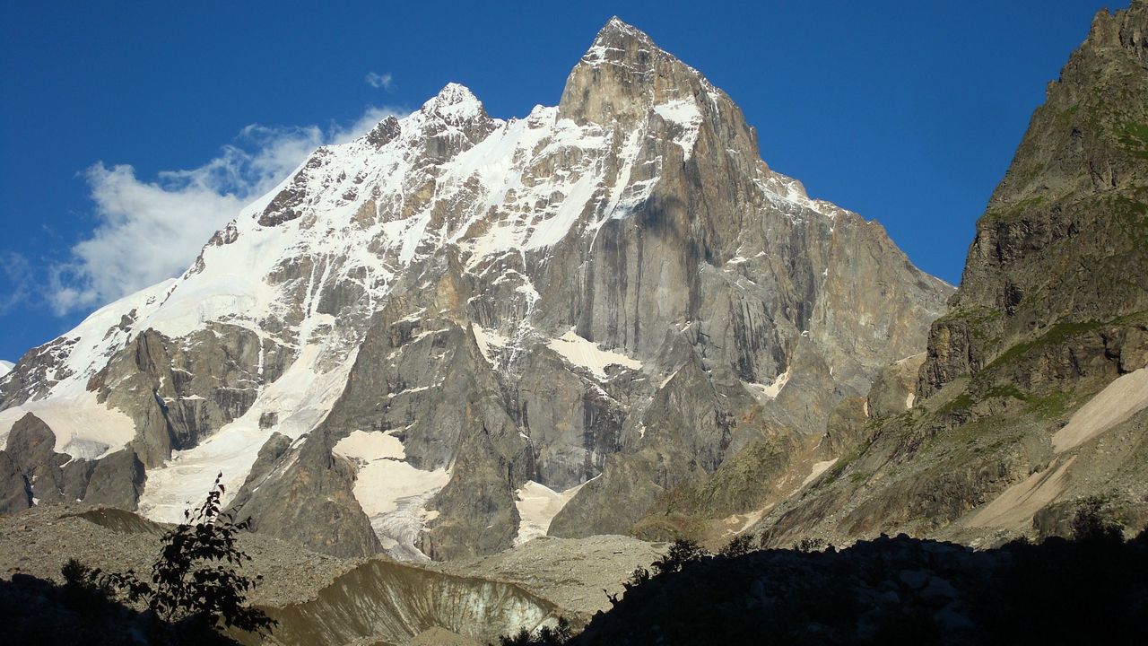 Wallpaper mountain, peak, top, gray, light, shadow, snow, solarly