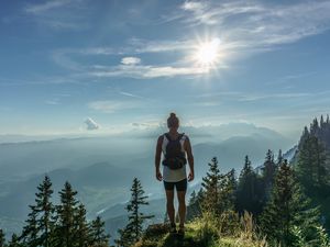 Preview wallpaper mountain, peak, tourist, man, sunlight