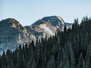 Preview wallpaper mountain, peak, trees, forest, sky