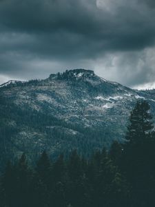 Preview wallpaper mountain, peak, trees, cloudy