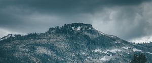 Preview wallpaper mountain, peak, trees, cloudy