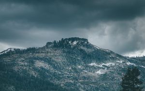 Preview wallpaper mountain, peak, trees, cloudy