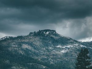 Preview wallpaper mountain, peak, trees, cloudy