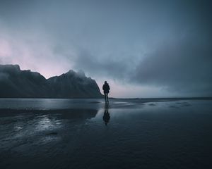 Preview wallpaper mountain, people, ocean, shore, walk, loneliness
