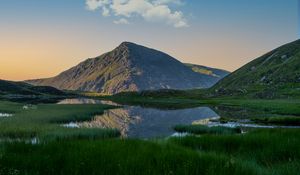 Preview wallpaper mountain, pond, grass, landscape, nature