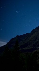 Preview wallpaper mountain, relief, trees, stars, night, landscape, dark