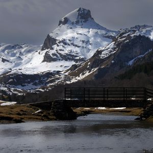 Preview wallpaper mountain, river, snow, bridge, landscape