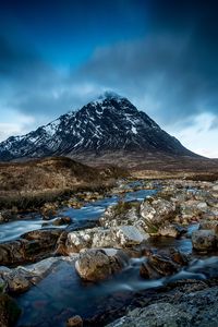 Preview wallpaper mountain, river, stones, clouds, sky, landscape, water, current