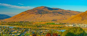 Preview wallpaper mountain, river, valley, buildings, village