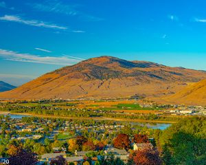 Preview wallpaper mountain, river, valley, buildings, village