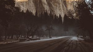 Preview wallpaper mountain, road, fog, trees, turn