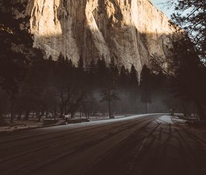 Preview wallpaper mountain, road, fog, trees, turn