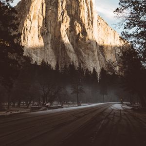 Preview wallpaper mountain, road, fog, trees, turn