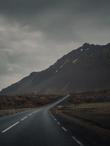 Preview wallpaper mountain, road, fog, asphalt, marking