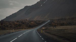 Preview wallpaper mountain, road, fog, asphalt, marking