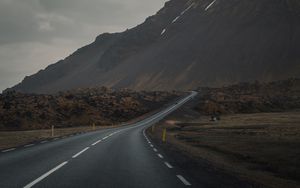 Preview wallpaper mountain, road, fog, asphalt, marking