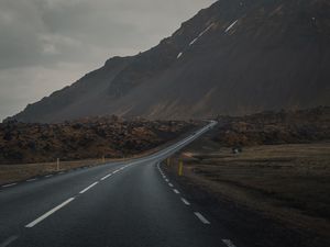 Preview wallpaper mountain, road, fog, asphalt, marking