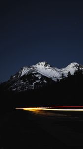 Preview wallpaper mountain, road, light, long exposure, dark