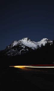 Preview wallpaper mountain, road, light, long exposure, dark
