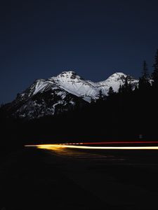 Preview wallpaper mountain, road, light, long exposure, dark