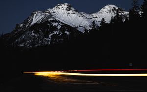 Preview wallpaper mountain, road, light, long exposure, dark