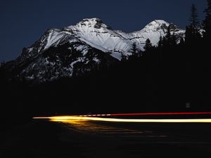 Preview wallpaper mountain, road, light, long exposure, dark