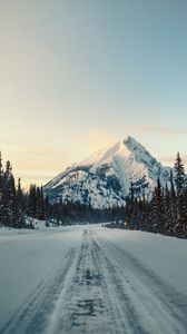 Preview wallpaper mountain, road, snow, winter, trees, landscape