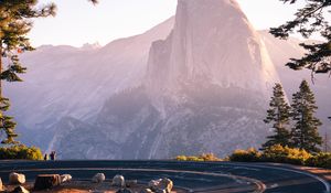 Preview wallpaper mountain, road, turn, branches, trees